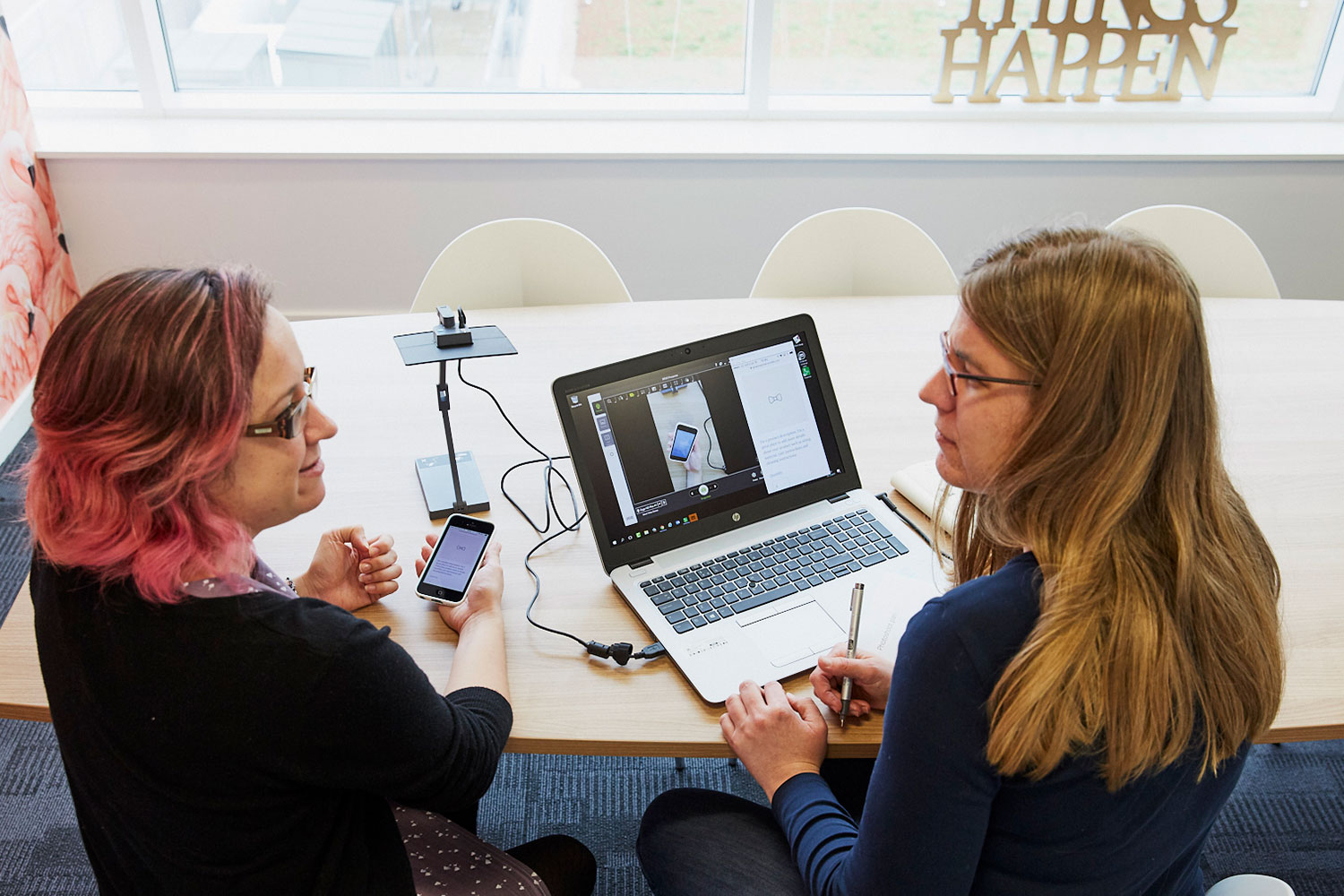 Two women discuss issues during snapshot user testing
